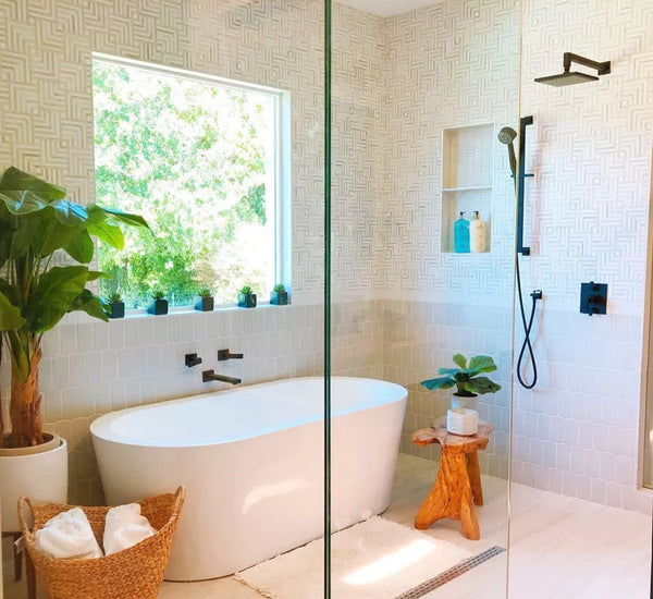 Black shower fixtures in white bathroom | photo from IG jmorrisdesigner